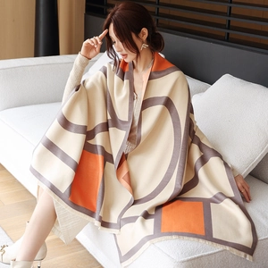 Detail view of thickened cashmere geometric color block shawl with tassel edges