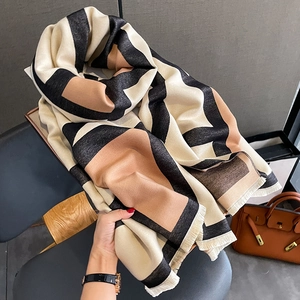 Thick geometric color block scarf in cream and brown with soft tassel edges