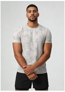 Detail of light grey athletic shirt featuring breathable fabric and geometric print pattern
