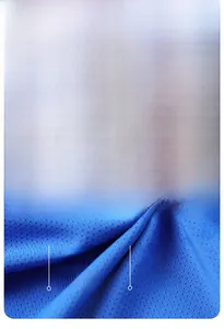 Macro detail of breathable navy blue mesh fabric with 90% polyester and 10% spandex blend