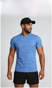 Detail of blue men's quick-dry sports t-shirt with geometric camouflage texture