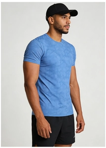 Close-up of blue quick-dry fabric with geometric patterns on men's sport T-shirt