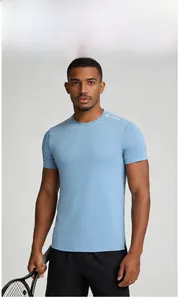 Detail of light blue quick-dry sports shirt with reflective shoulder stripes on male model