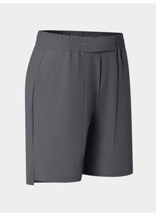 Detail of dark grey quick-dry sports shorts featuring elastic waistband and side split hem