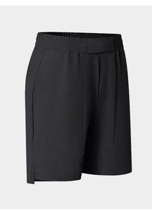 Detail of men's quick-dry black sports shorts showing elastic waistband and side split hem