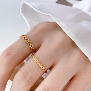 Japanese style gold olive leaf and hollow star chain rings set for women worn by a model