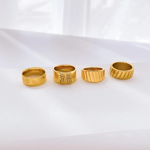 Set of four gold stainless steel rings featuring Fu character and floral engravings