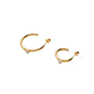 Golden C-shaped hoop earrings with micro-pave cubic zirconia on a white background