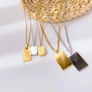 Close-up of geometric rectangle pendants in gold and silver finish with elegant chains