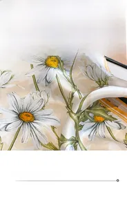 Detail of high-quality silk scarf showing premium stitching and daisy floral print