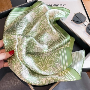 Elegant silk scarf featuring green sunflower patterns and stripes for stylish women