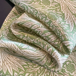 Elegant silk scarf with green floral pattern and premium glossy satin finish texture