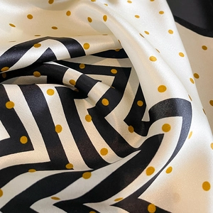Polka dot and stripe silk square scarf with golden accents and premium glossy texture