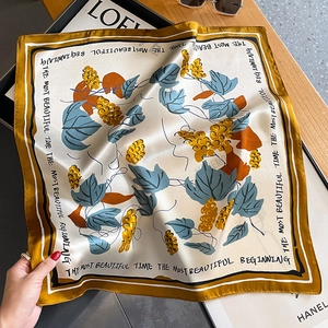Silk square scarf with botanical print and yellow border for autumn fashion styling