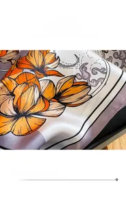 Detailed macro view of high-quality silk scarf edge stitching and digital floral print