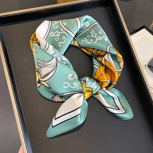 Floral print silk square scarf in mint green with yellow sunflowers and soft cloud patterns