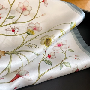 Elegant silk scarf with cherry blossom and daisy print, premium satin finish with blue trim