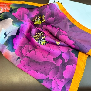 Satin silk scarf with purple peony and crane print featuring contrast orange edges