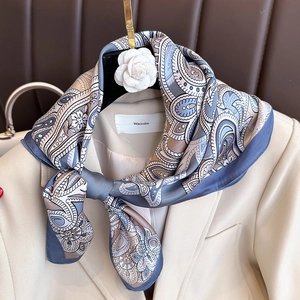 Elegant paisley satin square scarf in grey-blue and beige styled with a blazer