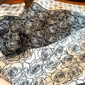 Fashionable paisley silk-like square scarf featuring bold rose floral prints and caramel borders
