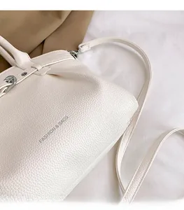 Close-up of white lychee pattern leather texture with Fashion & Bags text detail