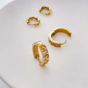 Detailed view of gold geometric hoop earrings with square zircon checkered pattern inlay