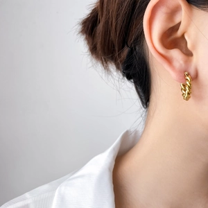 Elegant gold twisted rope hoop earrings for women made of durable titanium steel