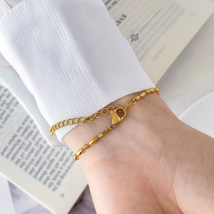 Detail of 18k gold plated titanium steel bead chain bracelet with lobster clasp and extender