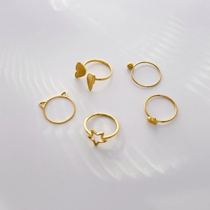 5-piece gold titanium steel ring set with butterfly, cat ears, and star motifs