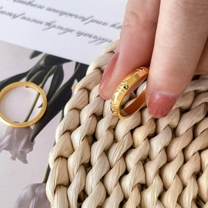 Chic 18K gold plated titanium ring with Roman numeral engravings and textured geometric pattern