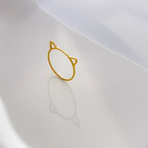 Detailed view of an 18k gold plated cat ear minimalist titanium steel open ring
