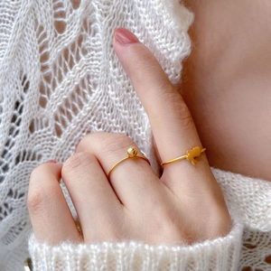 Polished 18K gold plated minimalist rings featuring gold bead and rabbit silhouette designs