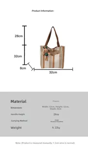 Detailed view of striped canvas tote bag with bunny pendant and size dimensions