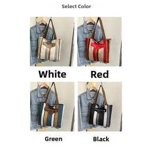 Striped canvas tote bags in white, red, green, and black with leather zip pocket detail