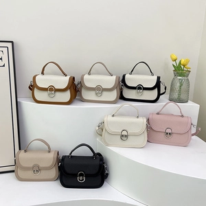 Retro patchwork crossbody bag with metal lock shown in 7 colorways on white steps