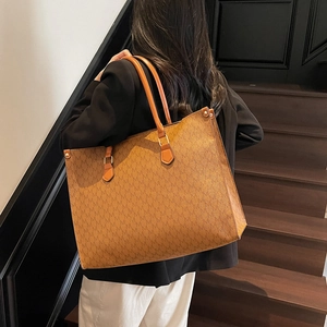 Vintage brown monogram tote bag with large capacity and elegant golden metal hardware