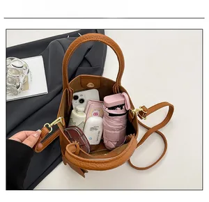 Top view of brown lychee leather bucket bag showing large capacity for daily items