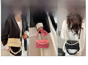 Chic pleated cloud bags with pearl handles shown in beige, pink and black styles