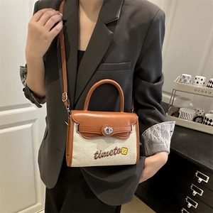 Brown and beige colorblock crossbody Kelly bag with 'time to' embroidery and top handle