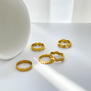 Minimalist 18K gold plated titanium steel ring set with textured wavy and gear patterns