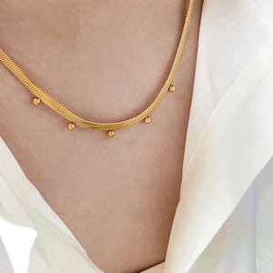 Gold snake chain necklace with five polished round bead pendants for women