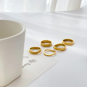 Five-piece minimalist 18k gold plated stainless steel ring set with textured and wave designs