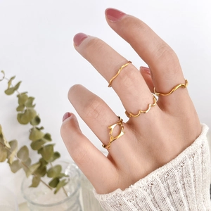 Set of four gold wave rings with irregular geometric branch designs for women