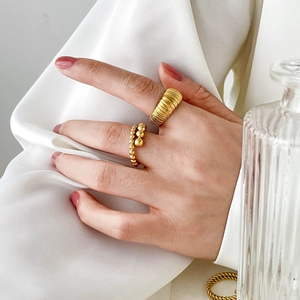 18K gold-plated stainless steel stackable rings with twisted texture and beaded design