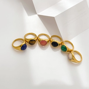Set of 6 gold plated stainless steel rings with oval natural stone inlays in varied colors