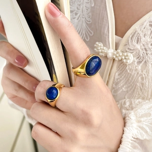 Gold plated 18K titanium ring with oval turquoise lapis stone in retro vintage style