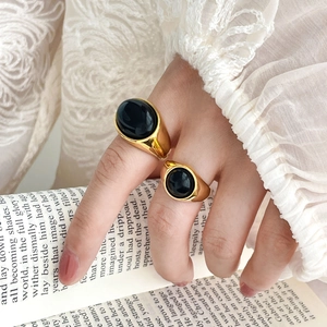 Vintage 18K gold plated titanium ring set with oval black onyx stones on hand