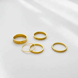 Detailed set of five vintage gold rings with Chinese engraving and sunburst textures
