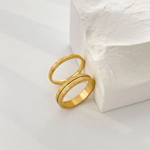 Matte 18K gold plated titanium steel rings with star engraving and sandblasted finish