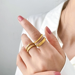 Frosted 18K gold plated titanium rings set with sandblasted finish for layered wear